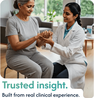 Vyana physiotherapist gently assessing an elderly patient's wrist