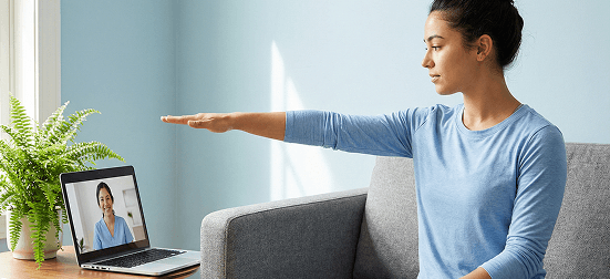 Woman performing physiotherapy exercise during a virtual session